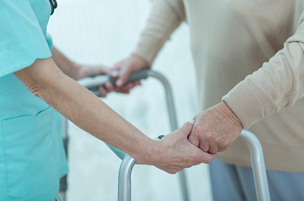 Nurse helping elderly patient