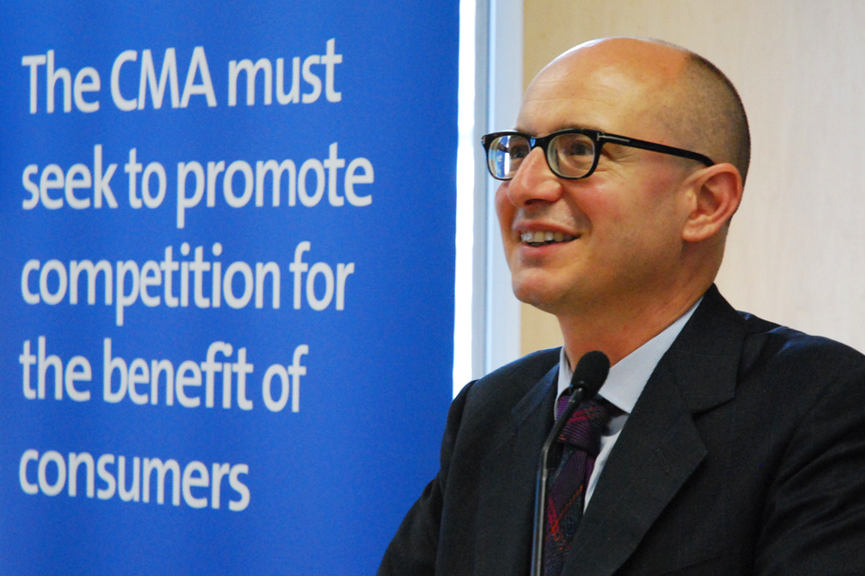 Andrea Coscelli, CEO of the CMA, in front of a board which reads, 'The CMA must seek to promote competition for the benefit of consumers'