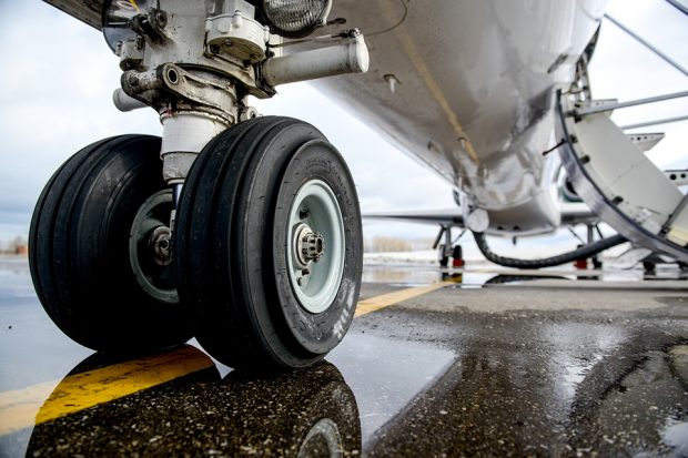 Close up of airplane wheels on runway