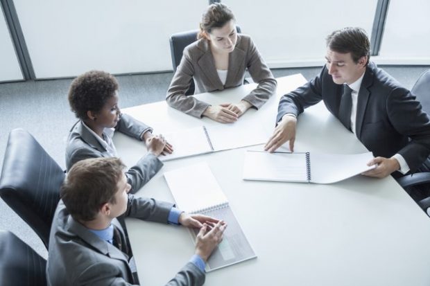 Business meeting with 4 participants in a meeting room